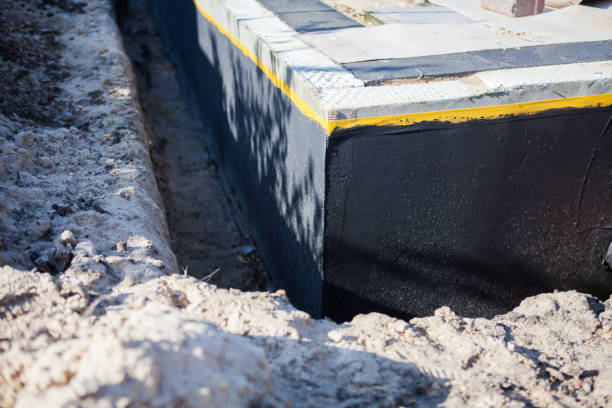 Professional Interior Drainage System technician working in Coker, AL